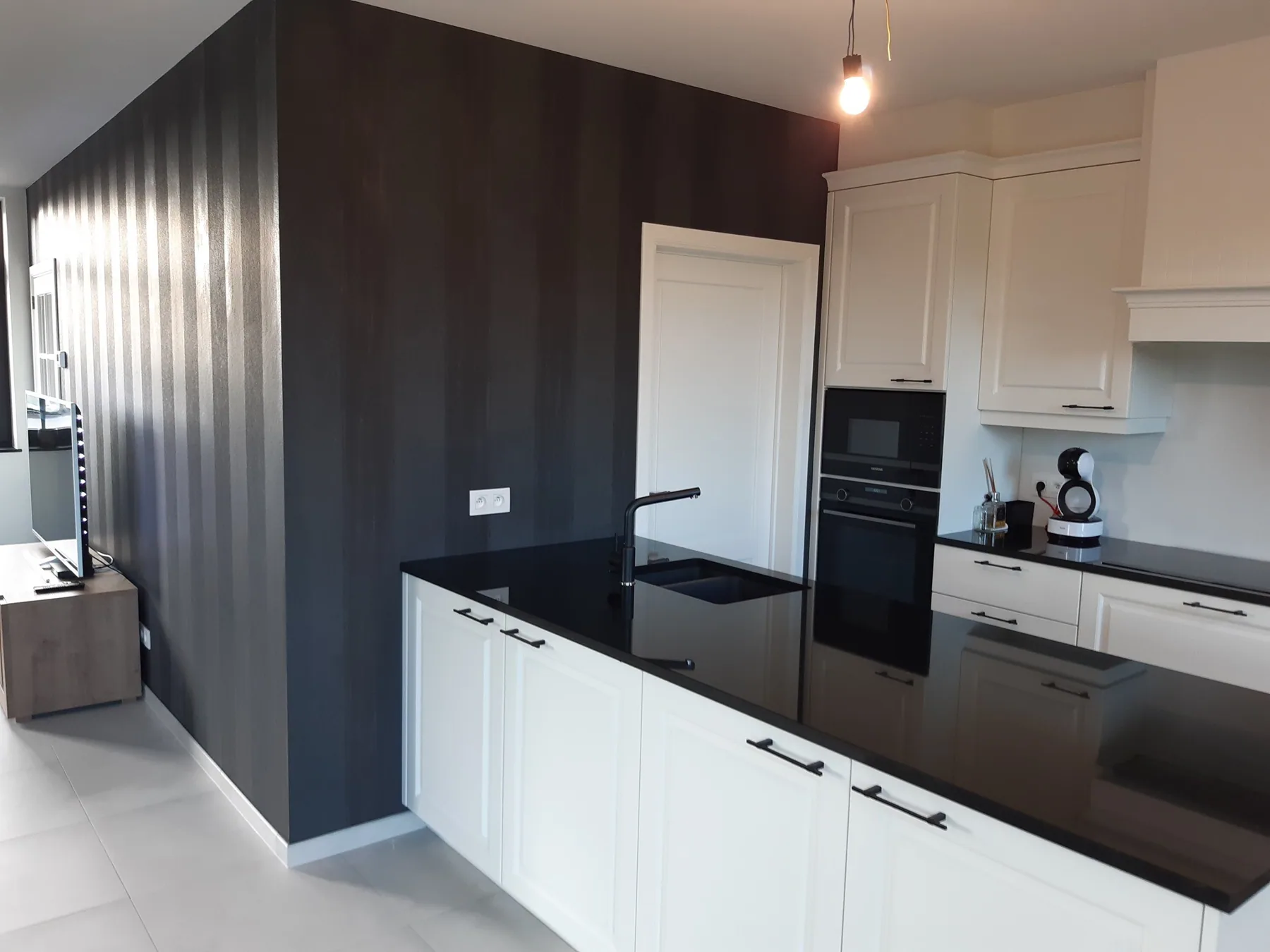 Behangwerken gecombineerd met raamdecoratie in Leuven